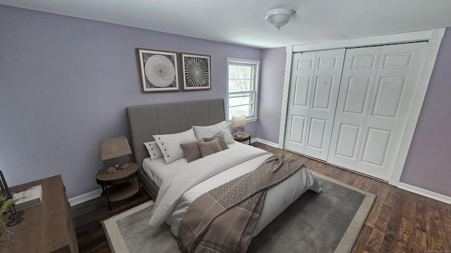 bedroom with dark hardwood / wood-style floors and a closet