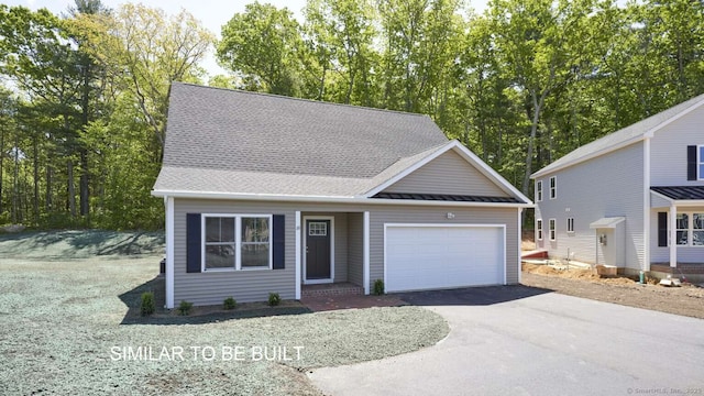 front of property with a garage