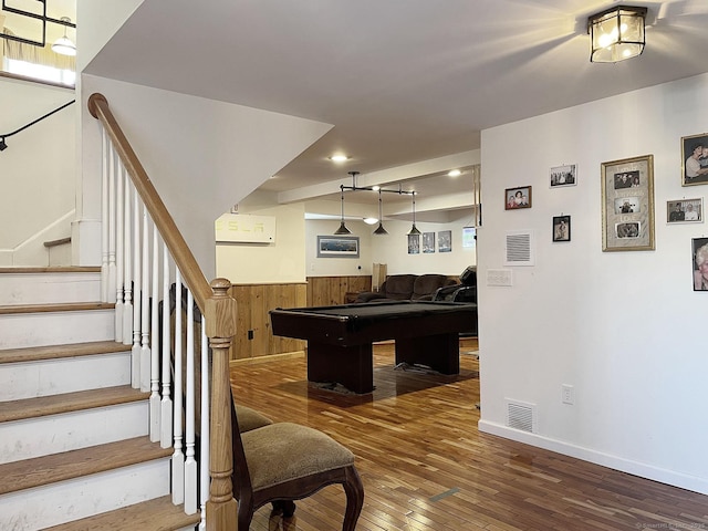 game room featuring pool table, dark hardwood / wood-style floors, an AC wall unit, and wooden walls