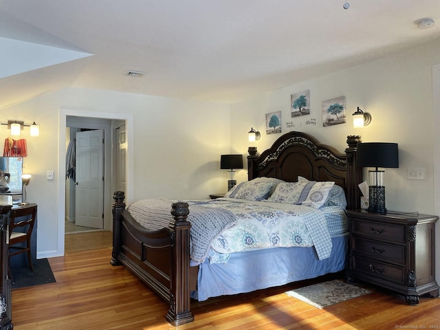 bedroom with light hardwood / wood-style flooring