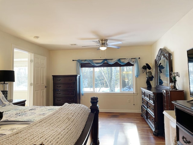 bedroom featuring ceiling fan and dark hardwood / wood-style flooring