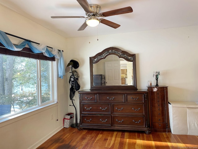 bedroom with wood-type flooring and ceiling fan