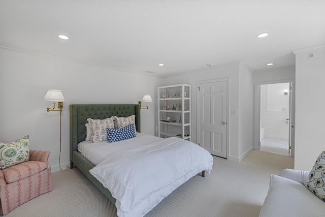 carpeted bedroom featuring connected bathroom and ornamental molding