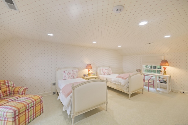 bedroom featuring lofted ceiling and radiator