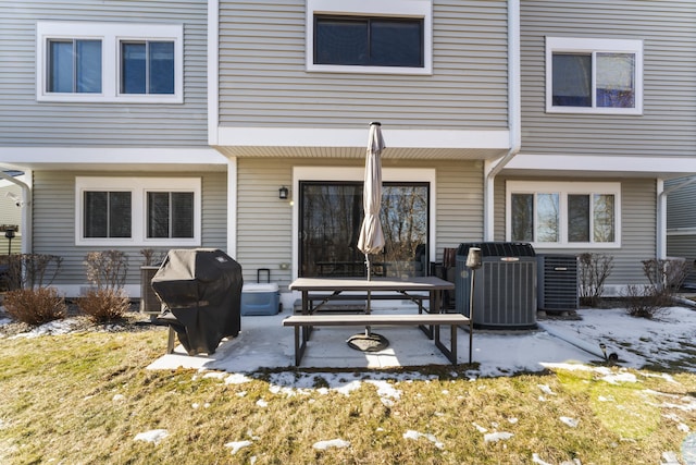 rear view of house with cooling unit and a patio area