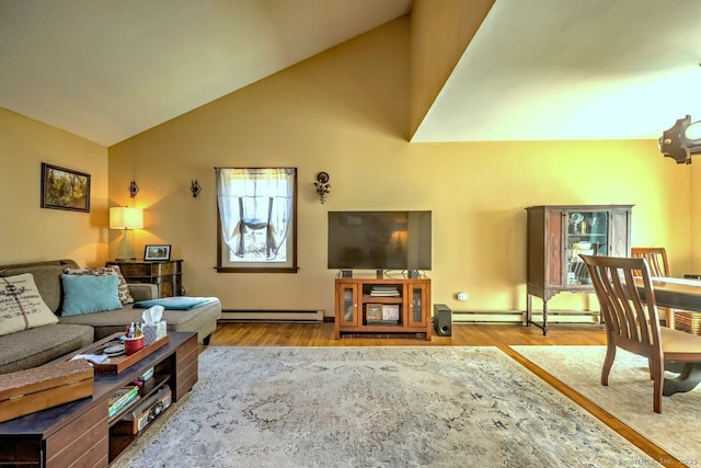 living room featuring lofted ceiling, a baseboard heating unit, and light wood-type flooring