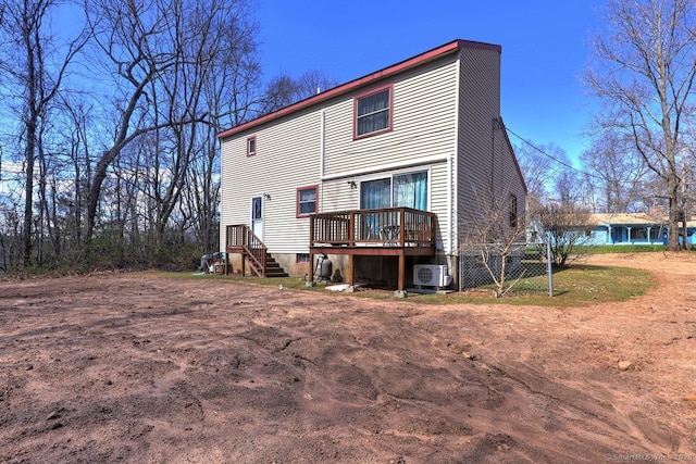 rear view of house with ac unit