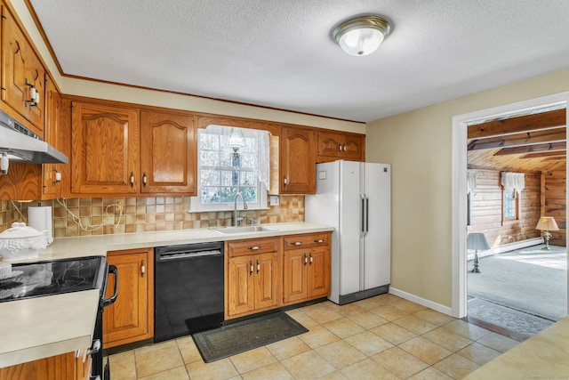 kitchen with sink, dishwasher, a textured ceiling, decorative backsplash, and white fridge