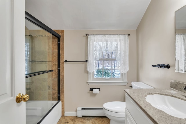 full bathroom featuring combined bath / shower with glass door, tile patterned flooring, a baseboard heating unit, vanity, and toilet