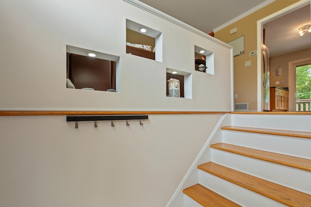 stairway with crown molding