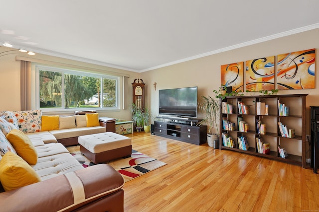 living room featuring crown molding and wood-type flooring