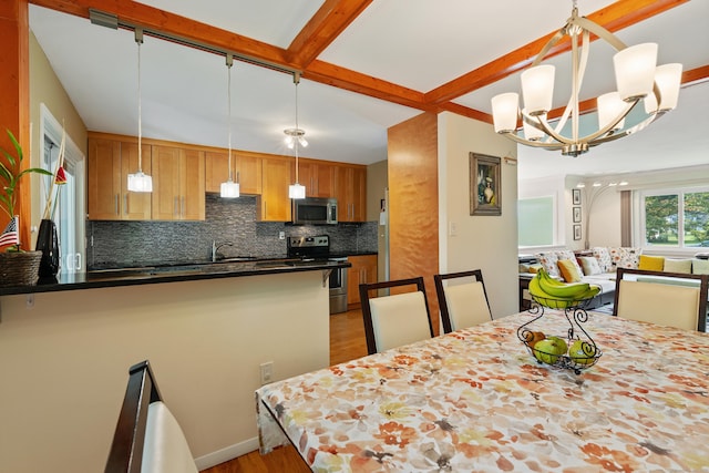 dining area with an inviting chandelier