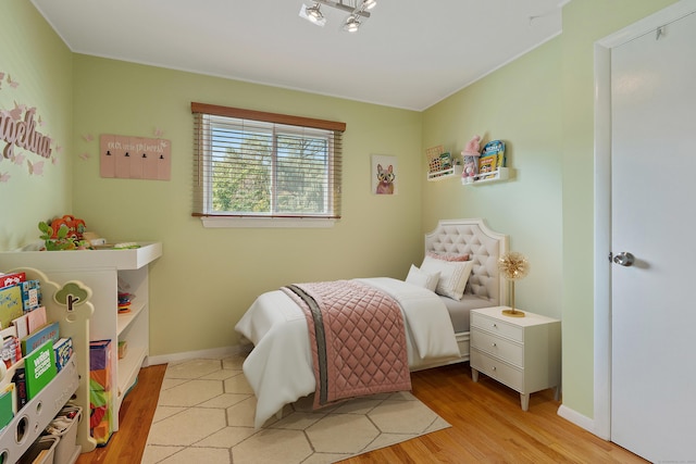 bedroom with light hardwood / wood-style flooring