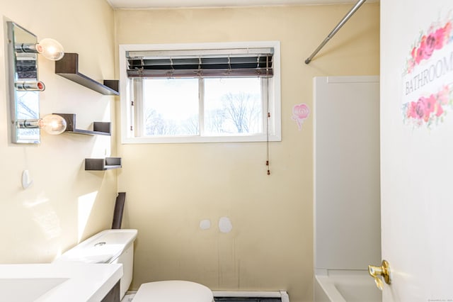 bathroom with baseboard heating, toilet, vanity, and  shower combination