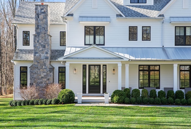 modern farmhouse featuring a front yard