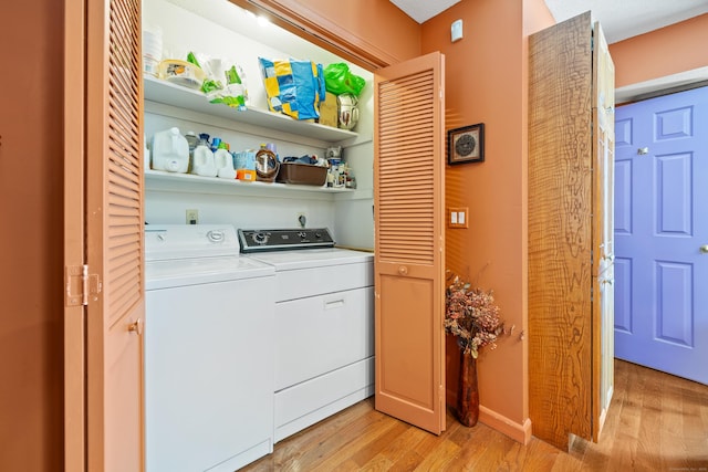 washroom featuring light wood-type flooring and electric dryer hookup