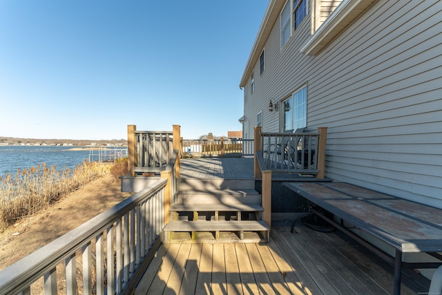 wooden terrace with a water view