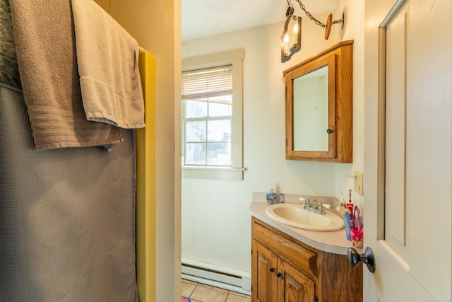 bathroom featuring a baseboard radiator, vanity, and tile patterned flooring