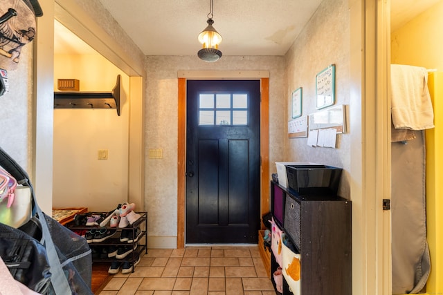 entryway with light tile patterned floors