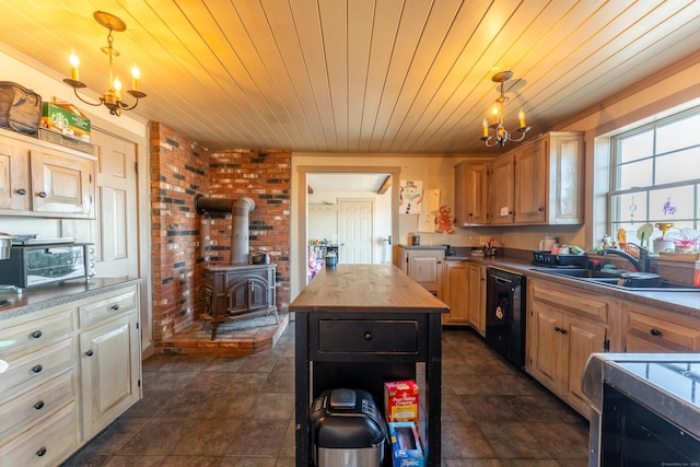 kitchen featuring hanging light fixtures, dishwasher, sink, and wooden counters