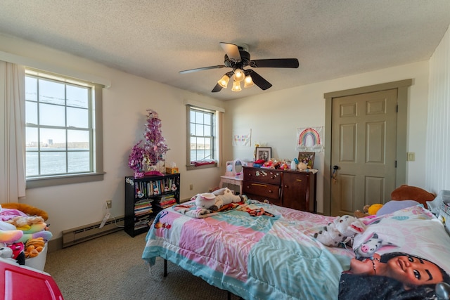 bedroom featuring carpet flooring, ceiling fan, baseboard heating, a water view, and a textured ceiling