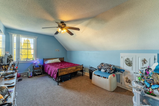 bedroom featuring ceiling fan, vaulted ceiling, a textured ceiling, and carpet