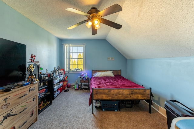 carpeted bedroom with ceiling fan, lofted ceiling, and a textured ceiling