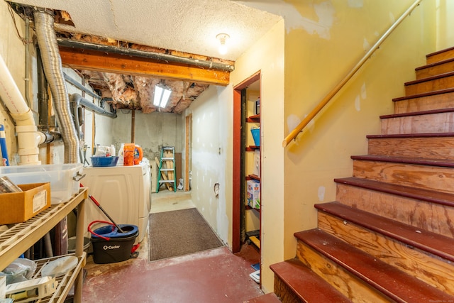 basement featuring washer and clothes dryer