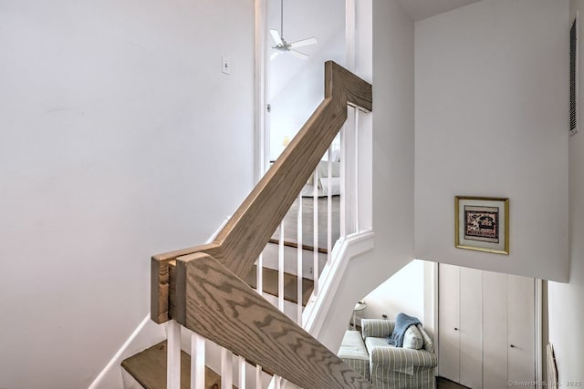 stairway with ceiling fan