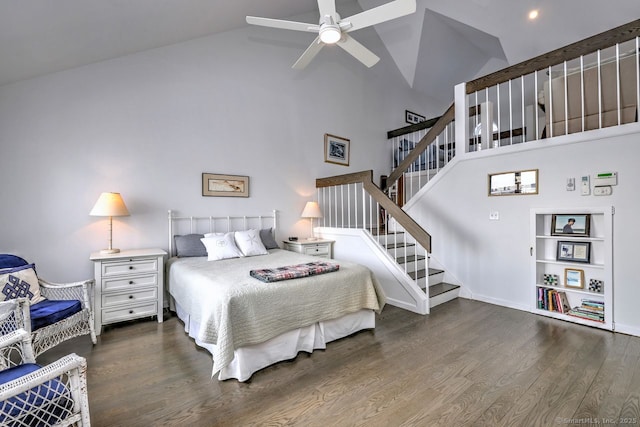 bedroom featuring dark hardwood / wood-style flooring, high vaulted ceiling, and ceiling fan