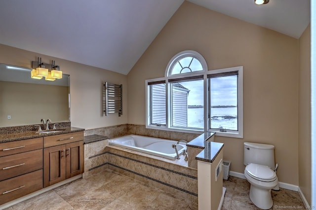 bathroom featuring a relaxing tiled tub, lofted ceiling, a healthy amount of sunlight, and vanity