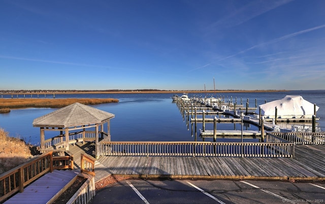 view of dock with a water view and a gazebo