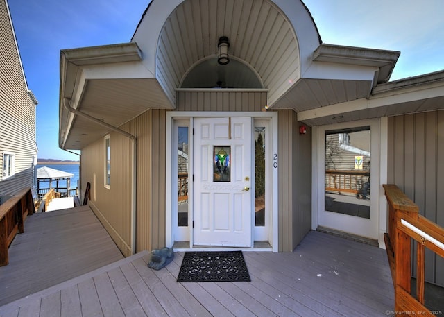 doorway to property with a water view