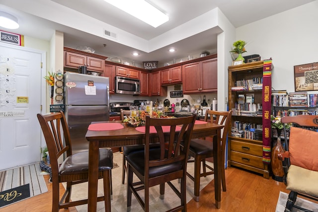 kitchen featuring stainless steel appliances and light wood-type flooring