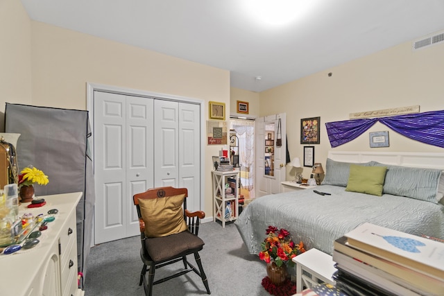 carpeted bedroom with a closet