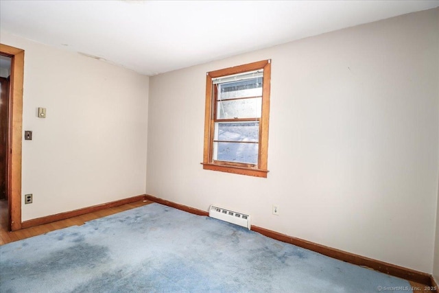 spare room featuring a baseboard radiator