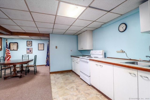 kitchen featuring white cabinetry, sink, a paneled ceiling, and white electric stove