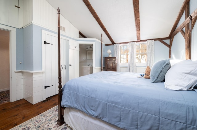 bedroom with dark hardwood / wood-style flooring, lofted ceiling with beams, and a closet