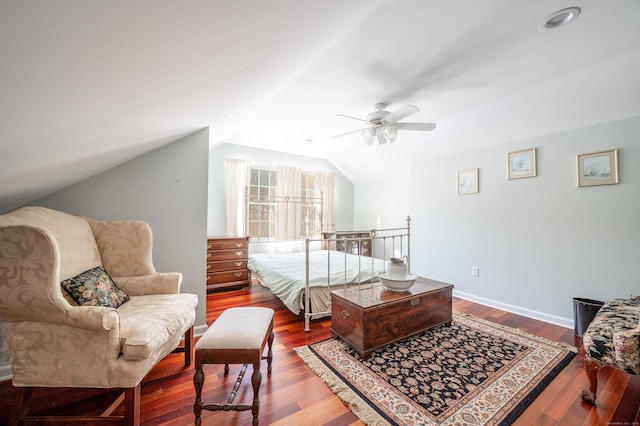 bedroom featuring hardwood / wood-style floors, vaulted ceiling, and ceiling fan