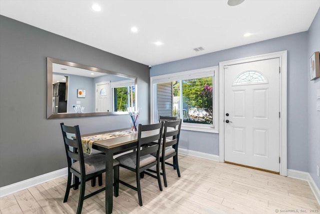 dining area with light hardwood / wood-style flooring