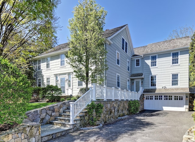 colonial inspired home featuring a garage