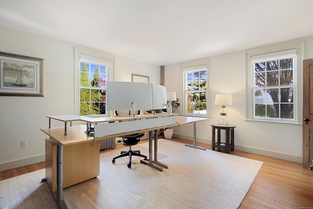 office featuring light wood-style flooring and baseboards