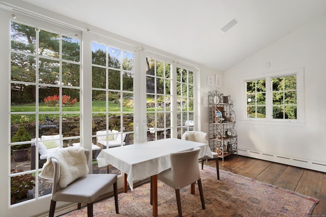 sunroom / solarium with lofted ceiling, french doors, and baseboard heating
