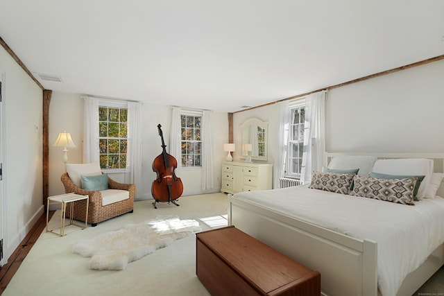 bedroom featuring carpet and baseboards