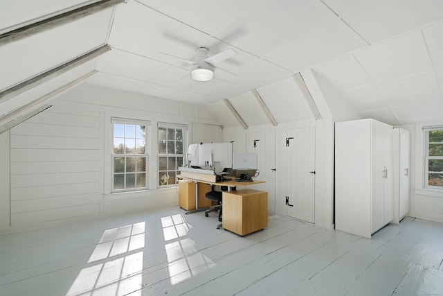 office space with lofted ceiling and ceiling fan