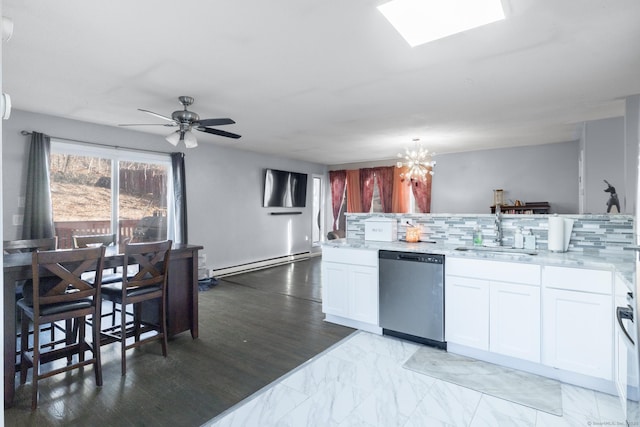 kitchen featuring white cabinetry, sink, stainless steel dishwasher, and baseboard heating