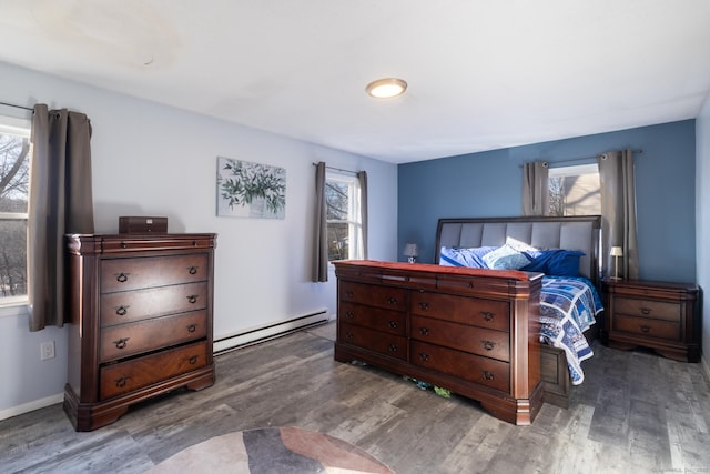 bedroom featuring hardwood / wood-style floors and a baseboard radiator