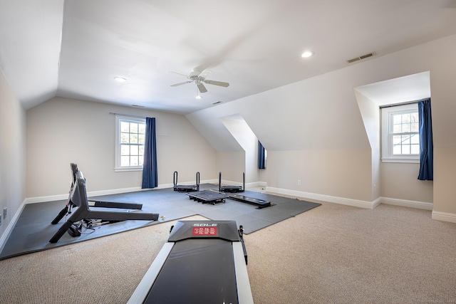 exercise area featuring vaulted ceiling, carpet flooring, and ceiling fan