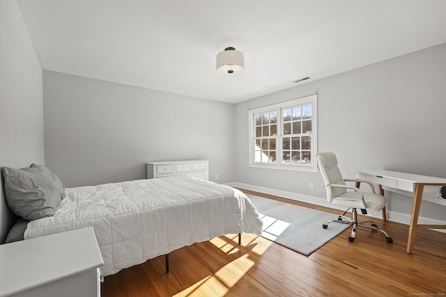 bedroom with light wood-type flooring