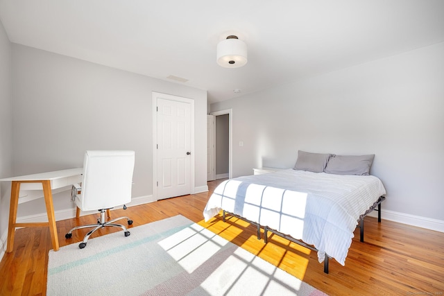 bedroom with light hardwood / wood-style floors